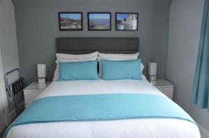 מיטה או מיטות בחדר ב-Portree Guest House