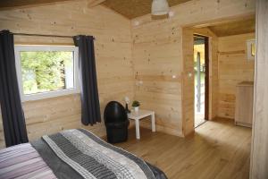 Postel nebo postele na pokoji v ubytování CampCity Frombork