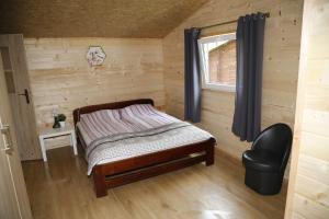 Postel nebo postele na pokoji v ubytování CampCity Frombork