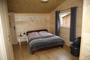 Postel nebo postele na pokoji v ubytování CampCity Frombork