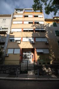 an apartment building with the front door open at Dimani in Split
