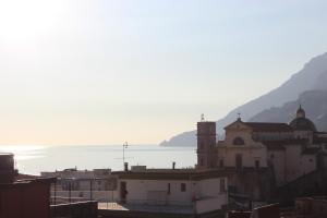 a view of a city with the ocean in the background at Casa Blu Cobalto in Maiori