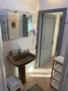 a bathroom with a sink and a mirror at Sant Andrea Country Cottage in Barberino di Mugello +35 photos