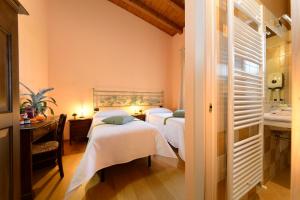 מיטה או מיטות בחדר ב-Agriturismo Bacche di Bosco
