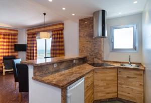 Kuchyň nebo kuchyňský kout v ubytování Hotel Apartamentos Bajondillo