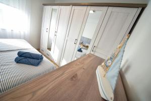 Postel nebo postele na pokoji v ubytování Apartmani Rudius