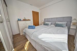 Postel nebo postele na pokoji v ubytování Apartmani Rudius