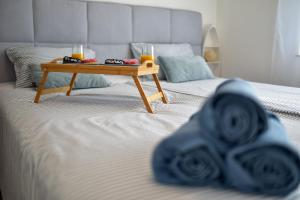 Postel nebo postele na pokoji v ubytování Apartmani Rudius