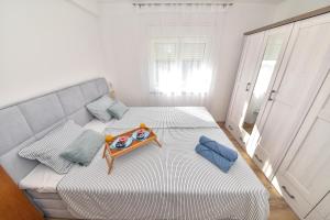Postel nebo postele na pokoji v ubytování Apartmani Rudius