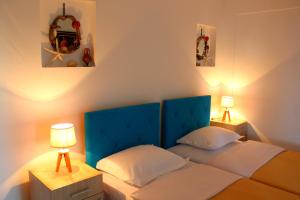A bed or beds in a room at Blue Mediterranean Apartments