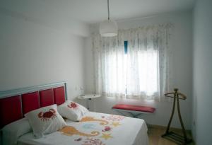A bed or beds in a room at Cantos do Coido