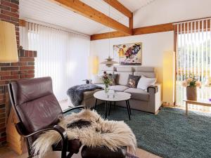 a living room with a couch and a table at 6 person holiday home in Gilleleje in Gilleleje
