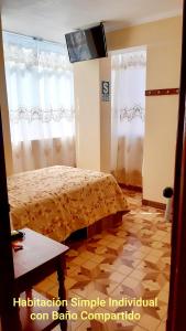TV a/nebo společenská místnost v ubytování Hostal Capac