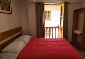 Postel nebo postele na pokoji v ubytování Tambo de Ollantay Hotel
