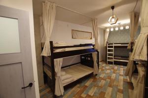 Postel nebo postele na pokoji v ubytování Cinnamon Guesthouse Dogo + 37 fotografií