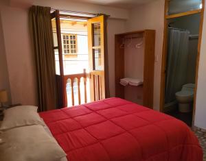 Postel nebo postele na pokoji v ubytování Tambo de Ollantay Hotel