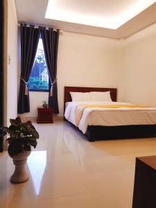 Voodi või voodid majutusasutuse Đà Lạt Cao Nguyên Hotel toas