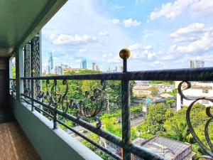 a balcony with a view of the city at The Montana Lodge-Sathorn in Bangkok