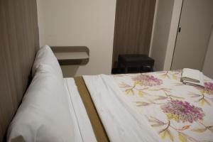 Postel nebo postele na pokoji v ubytování Hotel Winn Comfort