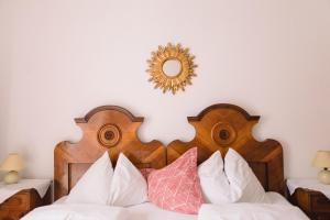 Łóżko lub łóżka w pokoju w obiekcie Gasthof Simony Hallstatt B&B