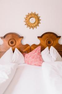 Łóżko lub łóżka w pokoju w obiekcie Gasthof Simony Hallstatt B&B