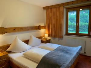 Postel nebo postele na pokoji v ubytování Ferienhaus am Burgsee