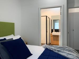 a bedroom with a bed and a dresser at BIG4 Yarra Valley Park Lane Holiday Park in Healesville