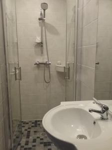a bathroom with a shower and a white sink at LA CLIMONTAINE in Urbeis +21 photos
