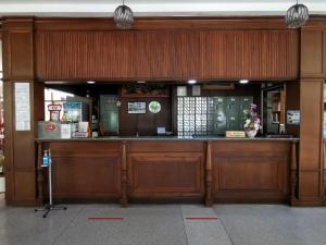 a restaurant with a bar in a building at Subhamitra Hotel Hua Hin-SHA Certified in Hua Hin