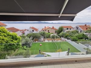 a view of a yard from a house at Villa Perla in Zadar