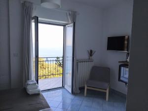 TV a/nebo společenská místnost v ubytování Judia Camere sul mare