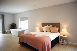 a bedroom with a large bed and a window at The Mount Rooms in Barry