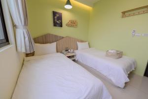 Postel nebo postele na pokoji v ubytování Mayu Hotel