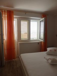 Posteľ alebo postele v izbe v ubytovaní Apartmani Stipan