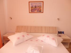 Posteľ alebo postele v izbe v ubytovaní Apartmani Stipan