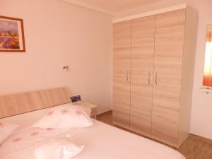 Posteľ alebo postele v izbe v ubytovaní Apartmani Stipan