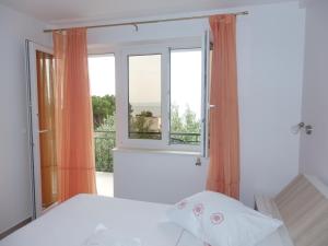 Posteľ alebo postele v izbe v ubytovaní Apartmani Stipan