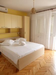 Posteľ alebo postele v izbe v ubytovaní Apartmani Stipan