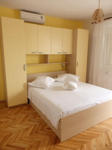 Posteľ alebo postele v izbe v ubytovaní Apartmani Stipan