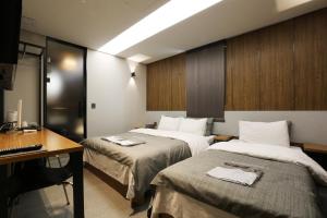 Katil atau katil-katil dalam bilik di boutique hotel k Dongdaemun