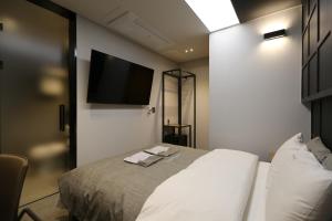 Ein Bett oder Betten in einem Zimmer der Unterkunft boutique hotel k Dongdaemun