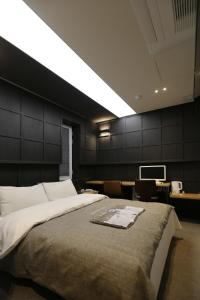 Ένα ή περισσότερα κρεβάτια σε δωμάτιο στο boutique hotel k Dongdaemun