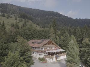 an aerial view of a house in the woods at Zur Guten Einkehr in Bayrischzell