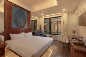 Voodi või voodid majutusasutuse HARI Residence & Spa toas