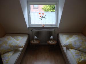 Postel nebo postele na pokoji v ubytování Poppenga - Feha Wallperle
