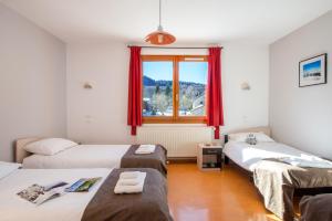 Una cama o camas en una habitación de Village vacances Chalet de la Haute-Joux