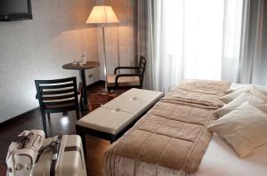 Letto o letti in una camera di c-hotels Fiume