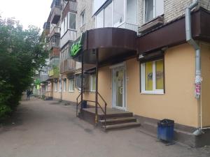 a building with a sign on the side of it at ОК! Усова, 25/1 №1 in Tomsk