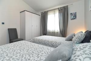 Postel nebo postele na pokoji v ubytování House Medulin 1744