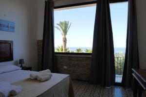 Postel nebo postele na pokoji v ubytování B&B Al Vecchio Pontile kitesurf